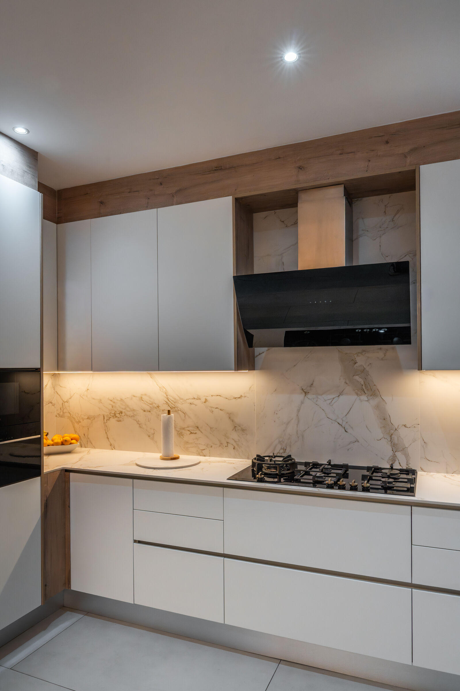 Craigavon Residence — cooking run and stone splashback, designed, manufactured and installed by The Kitchen Studio.