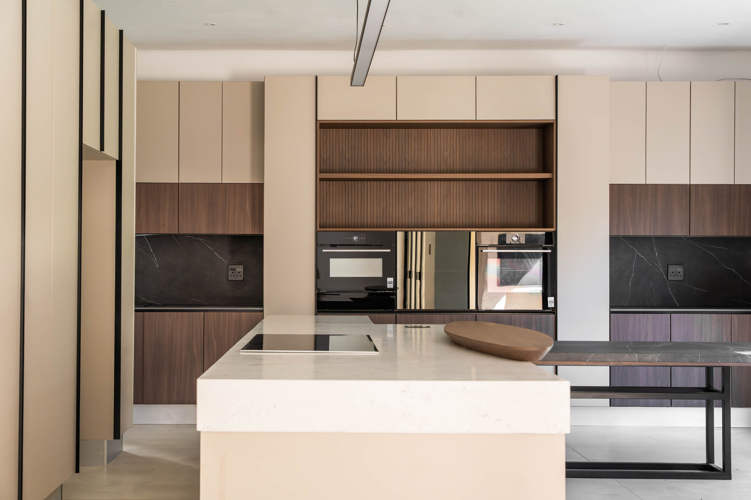 Greenside Residence — kitchen island and cooking run, designed, manufactured and installed by The Kitchen Studio.