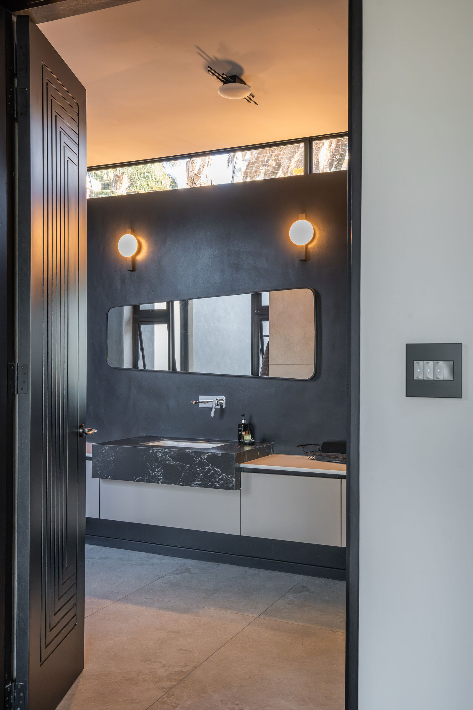 Northcliff Residence — vanity in a dark finish, designed, manufactured and installed by The Kitchen Studio.