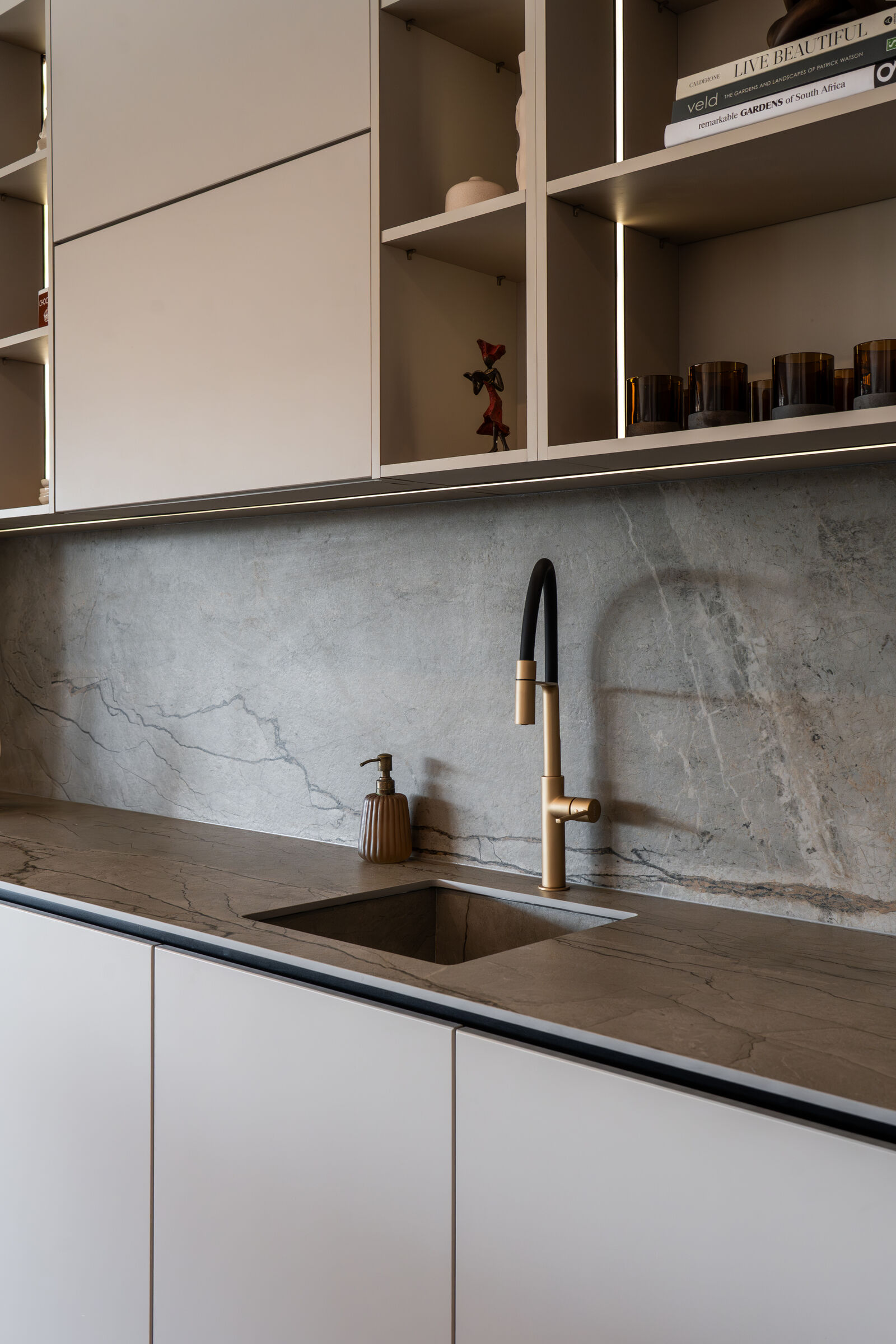 Westcliff Residence — stone worktop and tap detail, designed, manufactured and installed by The Kitchen Studio.