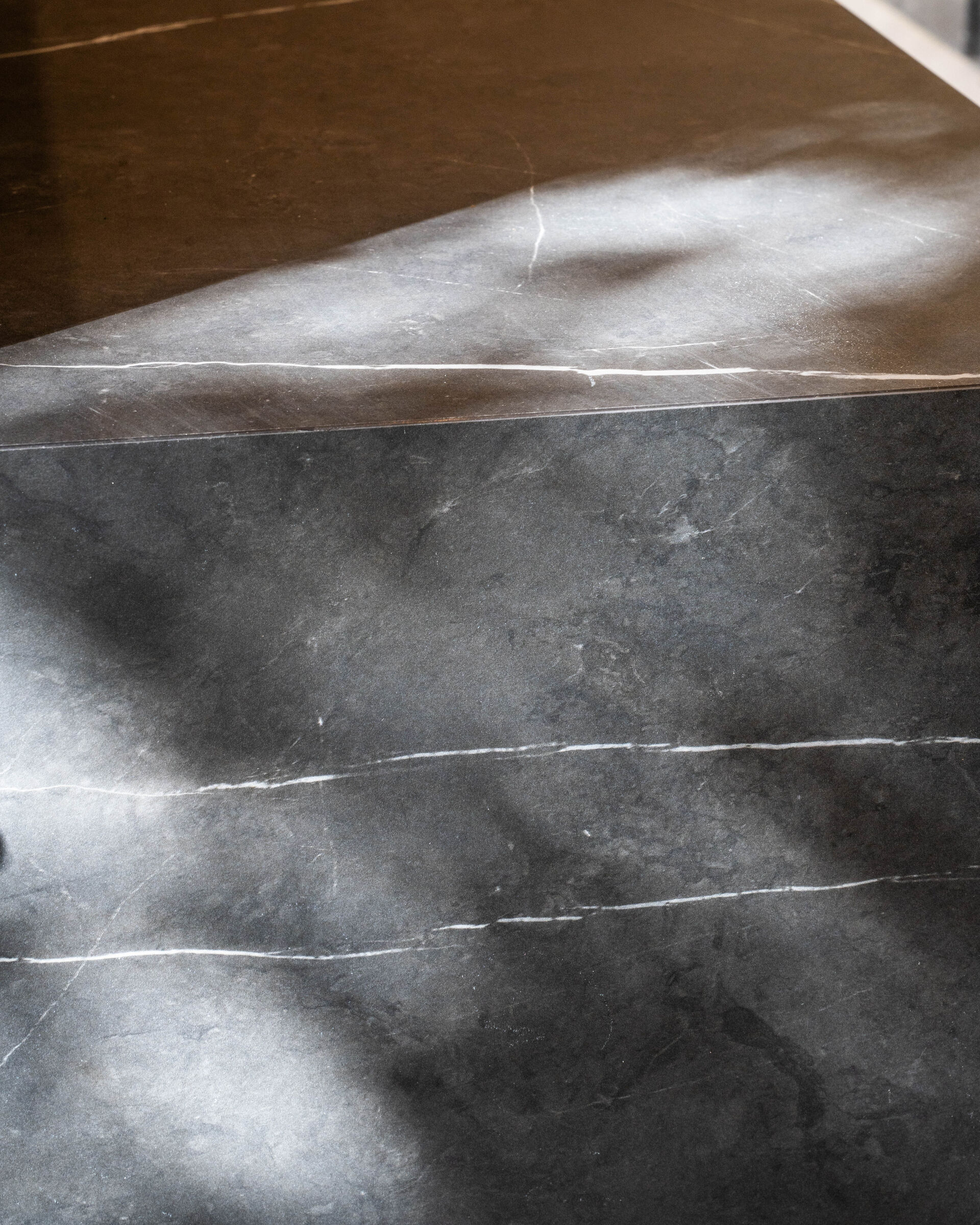 Greenside Residence — dark stone slab detail, designed, manufactured and installed by The Kitchen Studio.