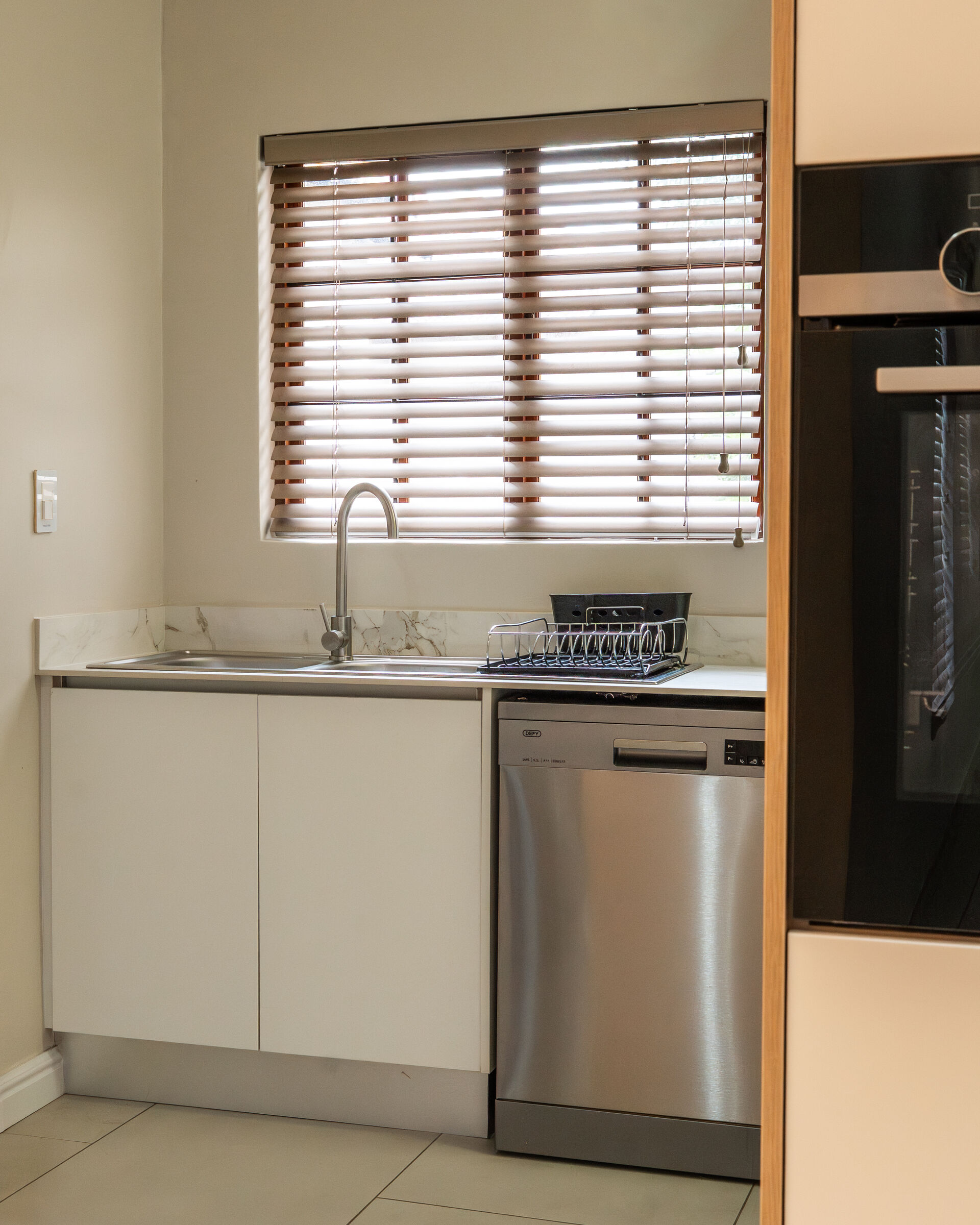 Craigavon Residence — scullery with fitted cabinetry, designed, manufactured and installed by The Kitchen Studio.
