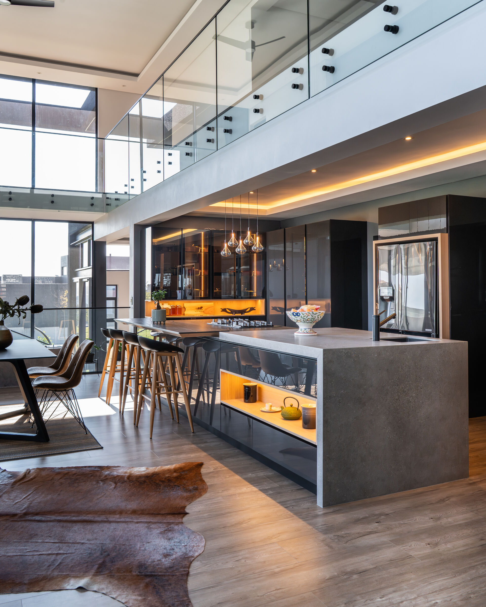 Steyn City Residence II — island with bar stools, designed, manufactured and installed by The Kitchen Studio.