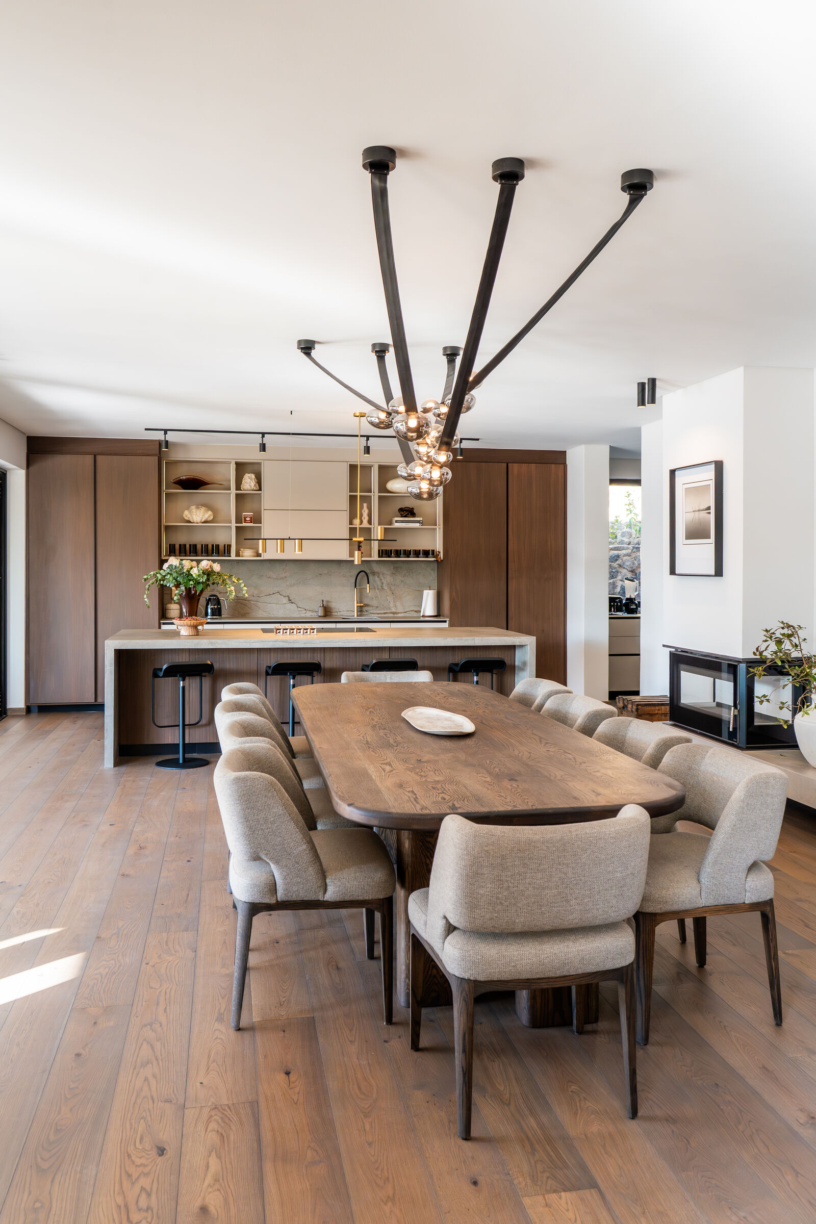 Westcliff Residence — dining table and kitchen beyond, designed, manufactured and installed by The Kitchen Studio.
