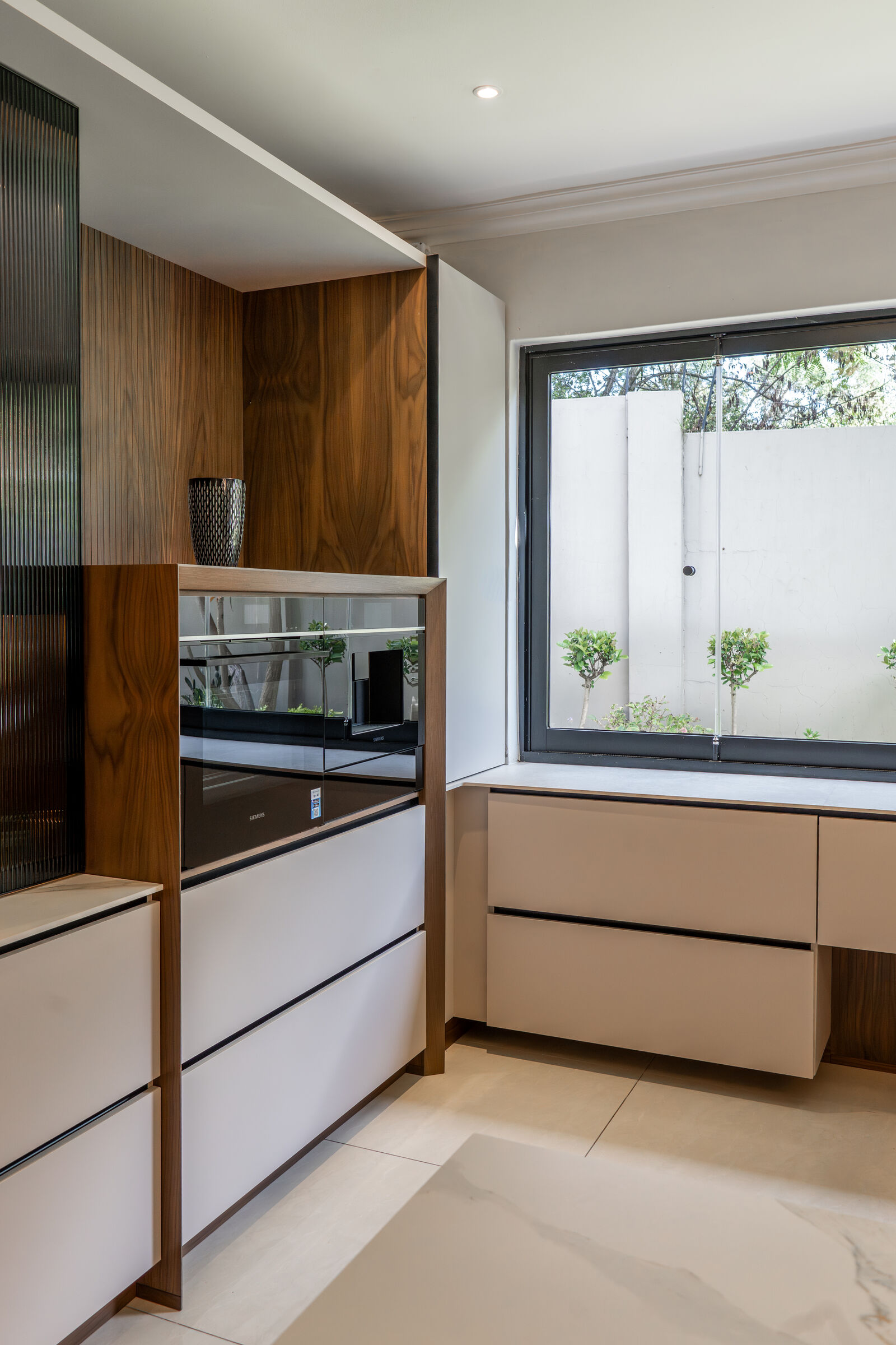 Houghton Residence — cooking run in timber and stone, designed, manufactured and installed by The Kitchen Studio.