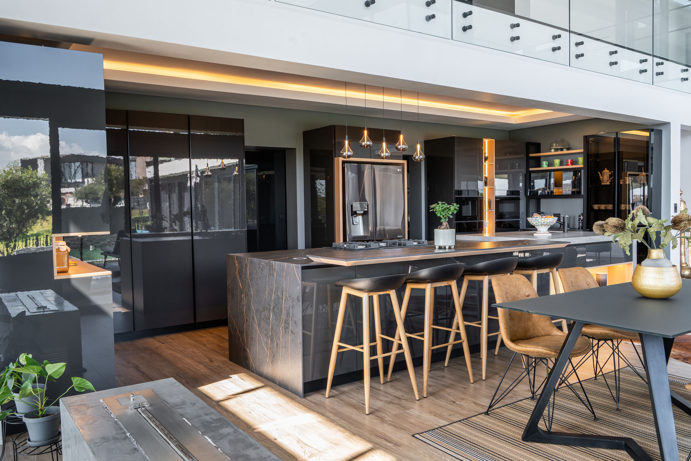 Steyn City Residence II — long kitchen island with seating, designed, manufactured and installed by The Kitchen Studio.
