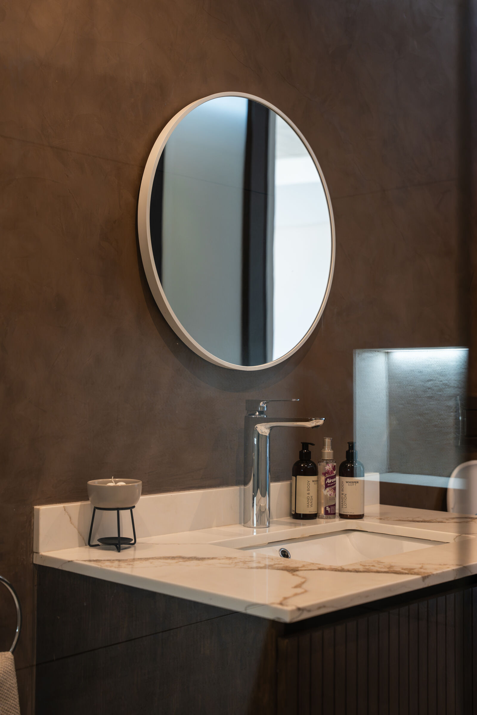 Northcliff Residence — stone vanity with mirror, designed, manufactured and installed by The Kitchen Studio.