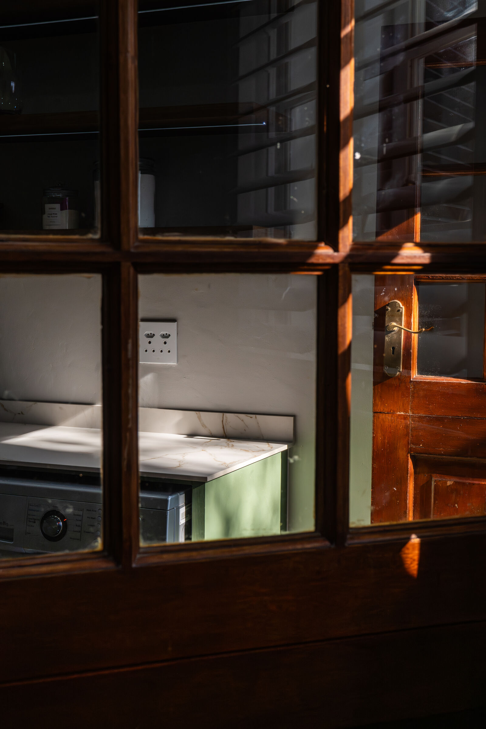 Bryanston Residence — glazed cabinetry detail, designed, manufactured and installed by The Kitchen Studio.