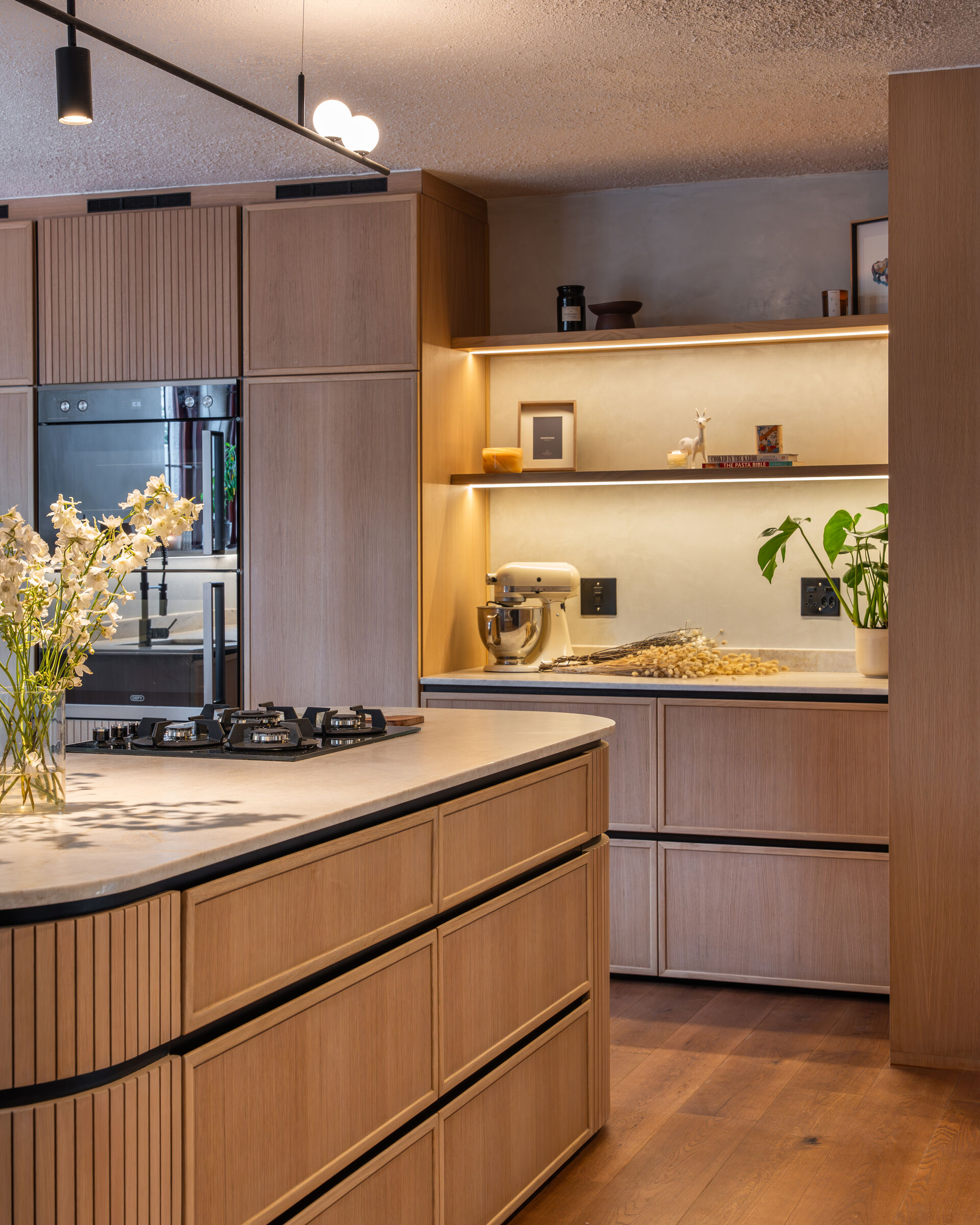 Bedford Park Residence — kitchen island in fluted oak, designed, manufactured and installed by The Kitchen Studio.