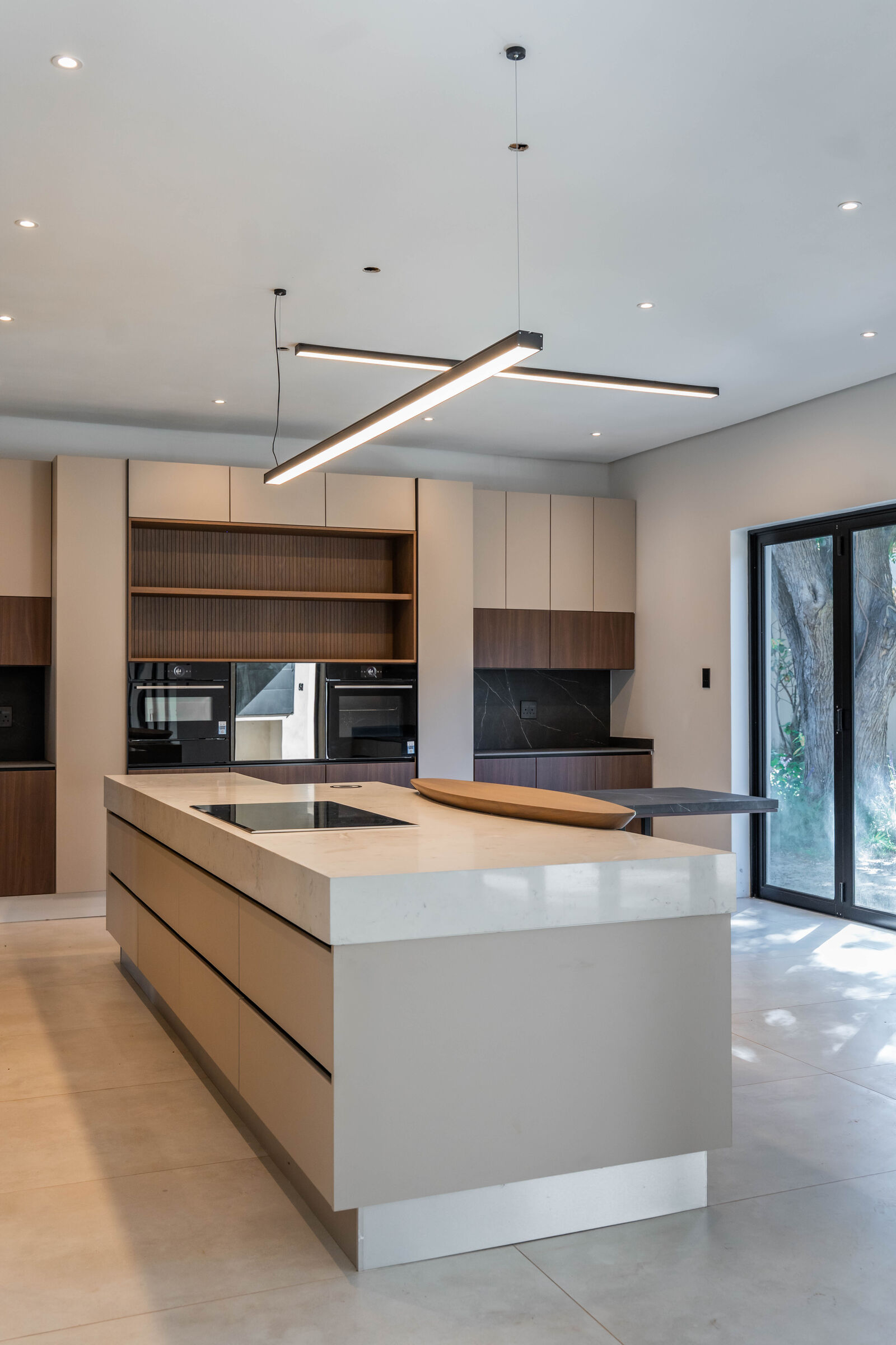 Greenside Residence — kitchen with linear lighting, designed, manufactured and installed by The Kitchen Studio.