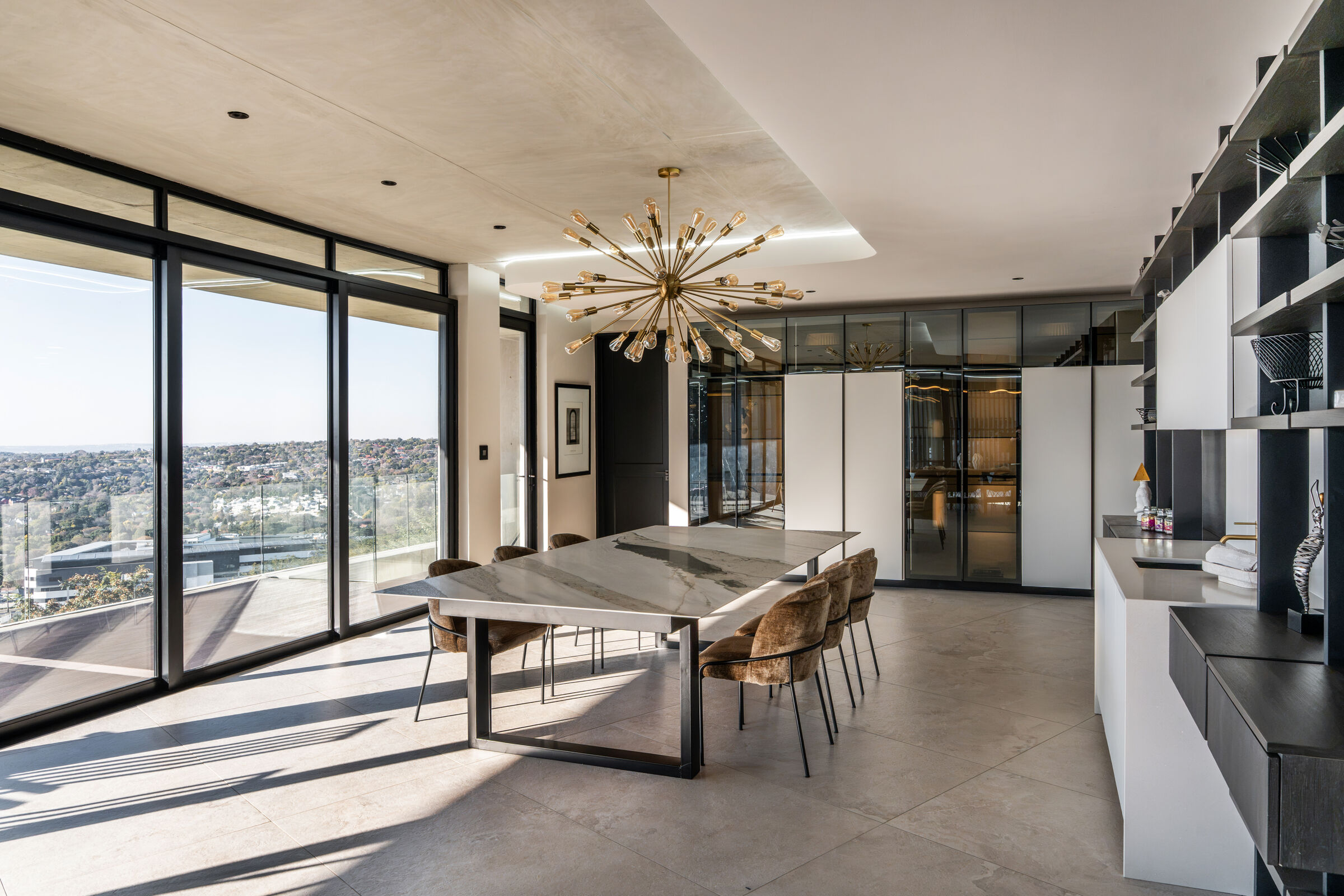 Northcliff Residence — dining space with fitted joinery, designed, manufactured and installed by The Kitchen Studio.
