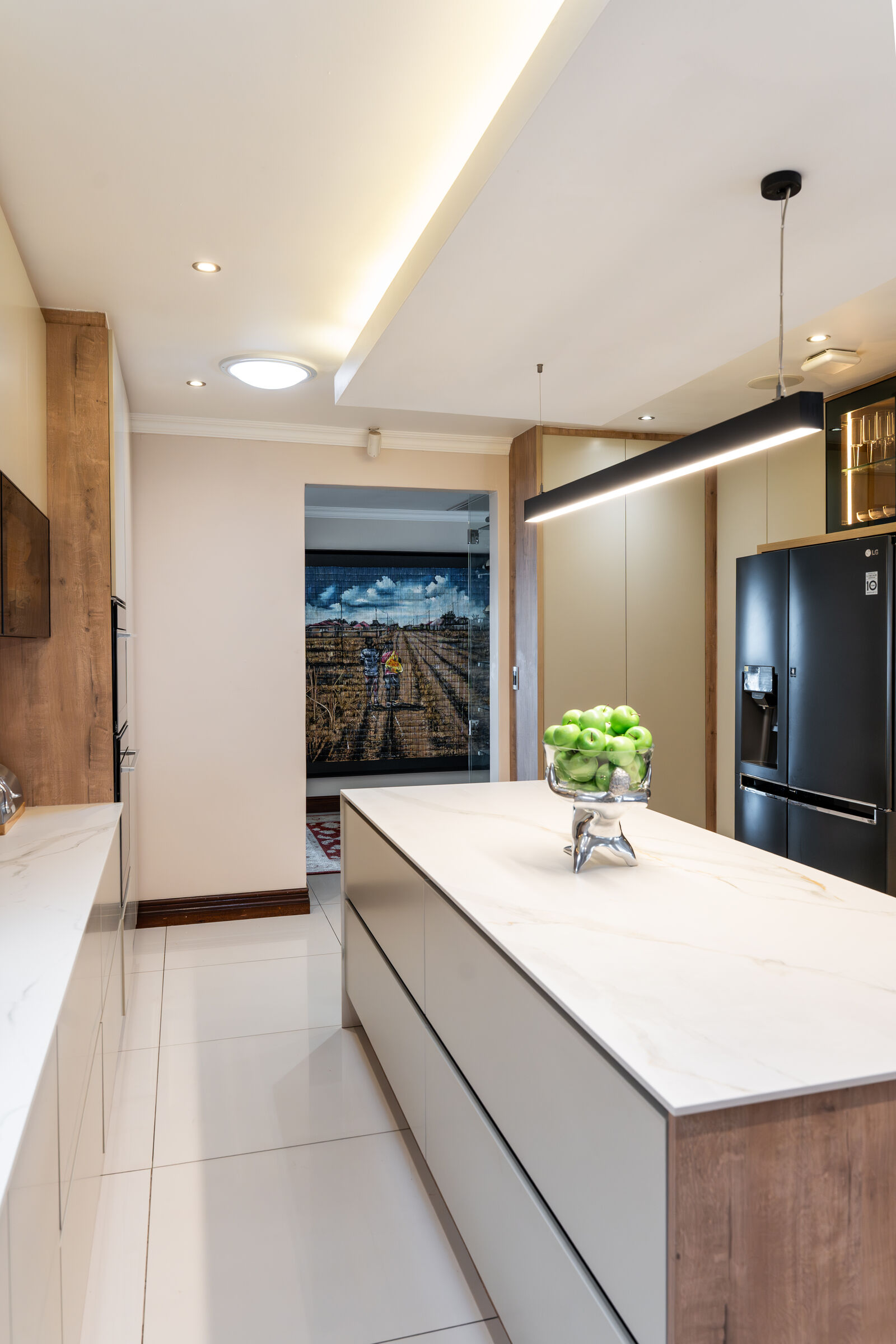 Sandton Residence — kitchen with cooking run, designed, manufactured and installed by The Kitchen Studio.