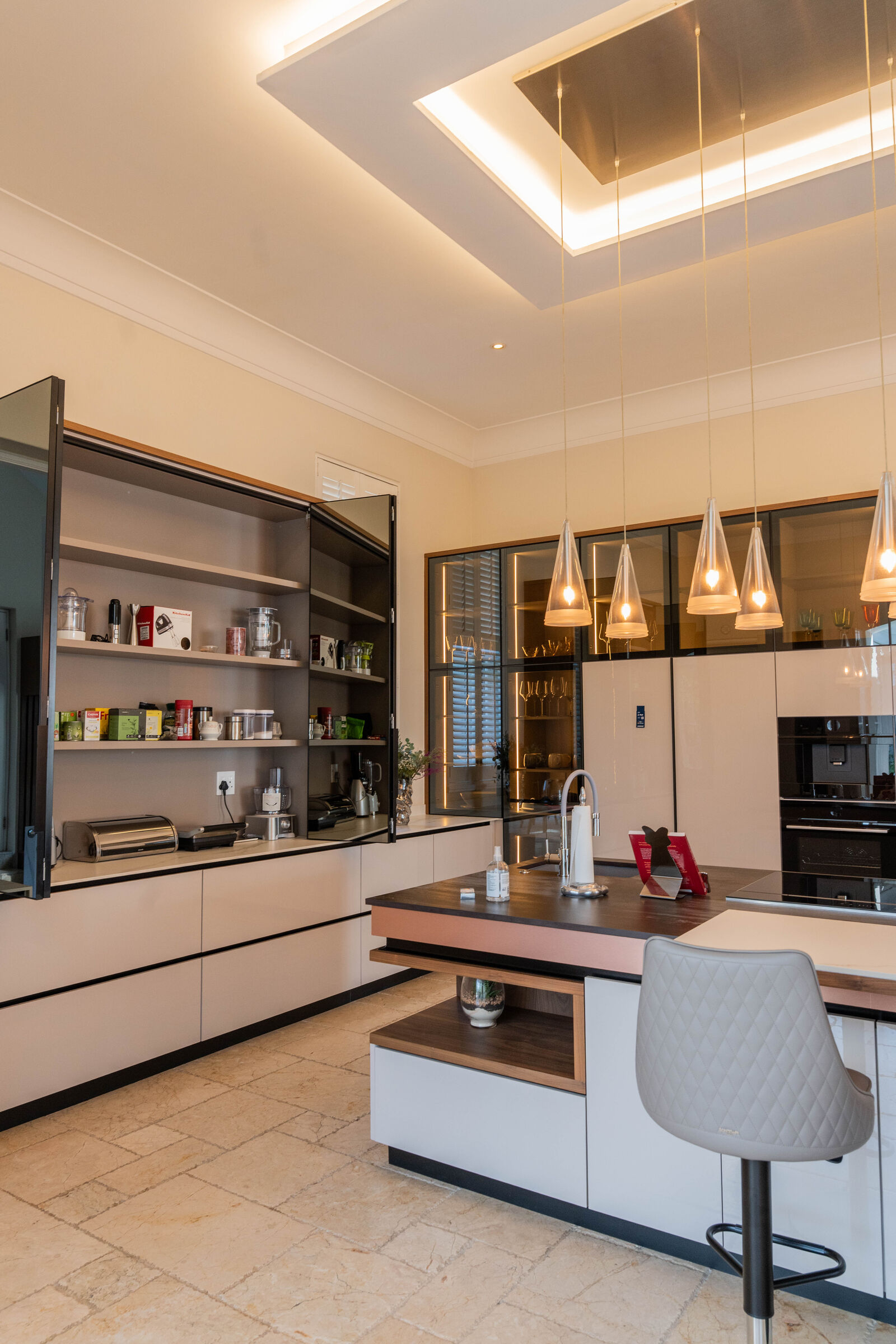 Sandhurst Residence — kitchen island and cooking run, designed, manufactured and installed by The Kitchen Studio.